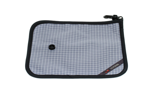 The back of a Tool Pen Wrap in Northwest Sky (light grey with white grid) 200 Halcyon.